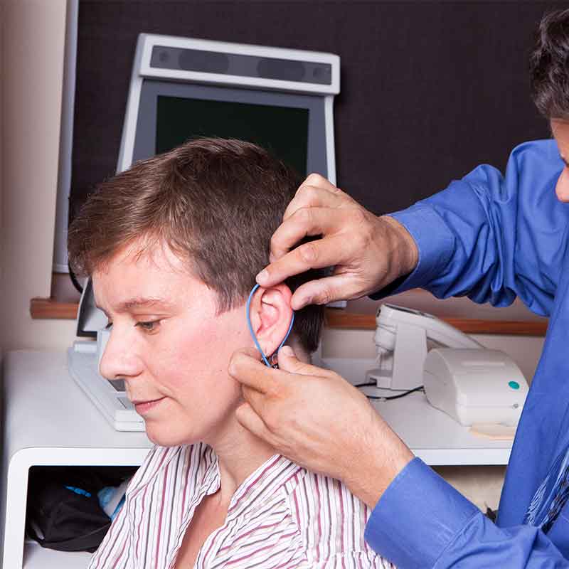 Woman receiving a real ear measurement